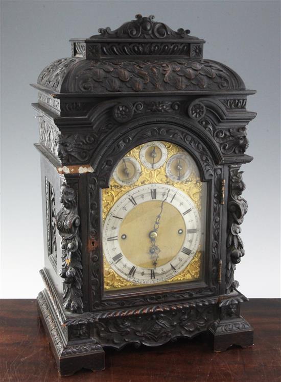 A late 19th century Maple & Co carved and ebonised oak chiming bracket clock, 23in., overall height 34in.